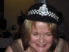 helen-brown-with-police-hat-at-the-annual-awards-party-2009